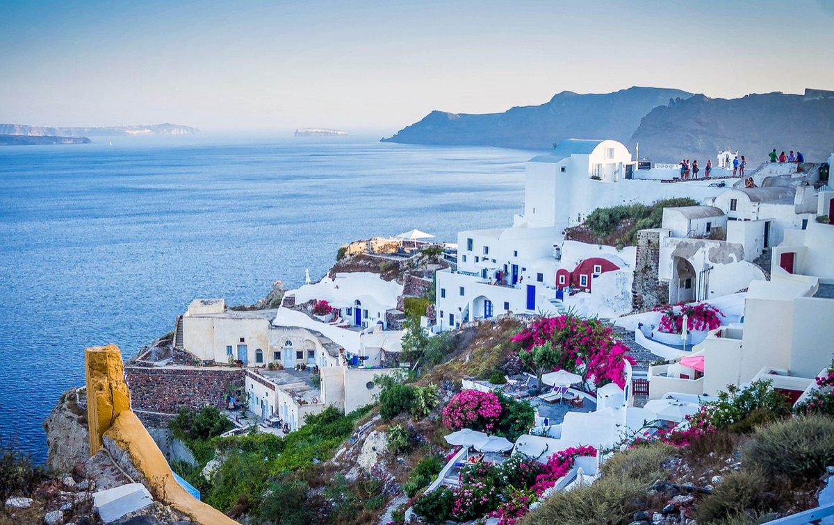 Santorini blue sea with white buildings in the distance