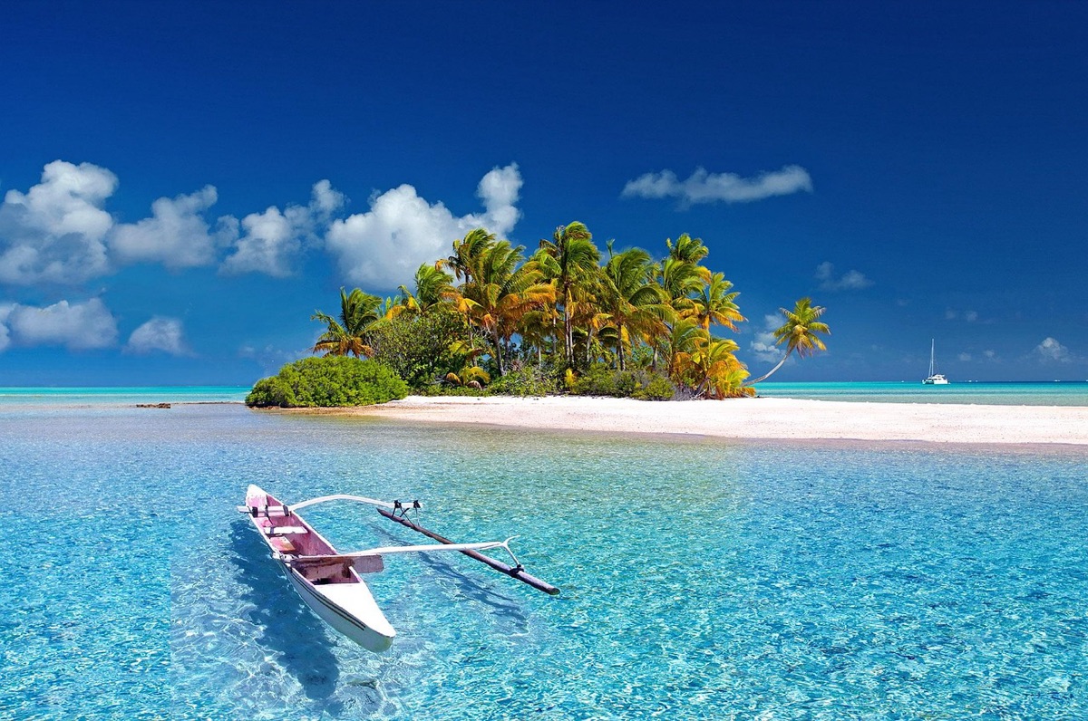 White building with blue sea in the background