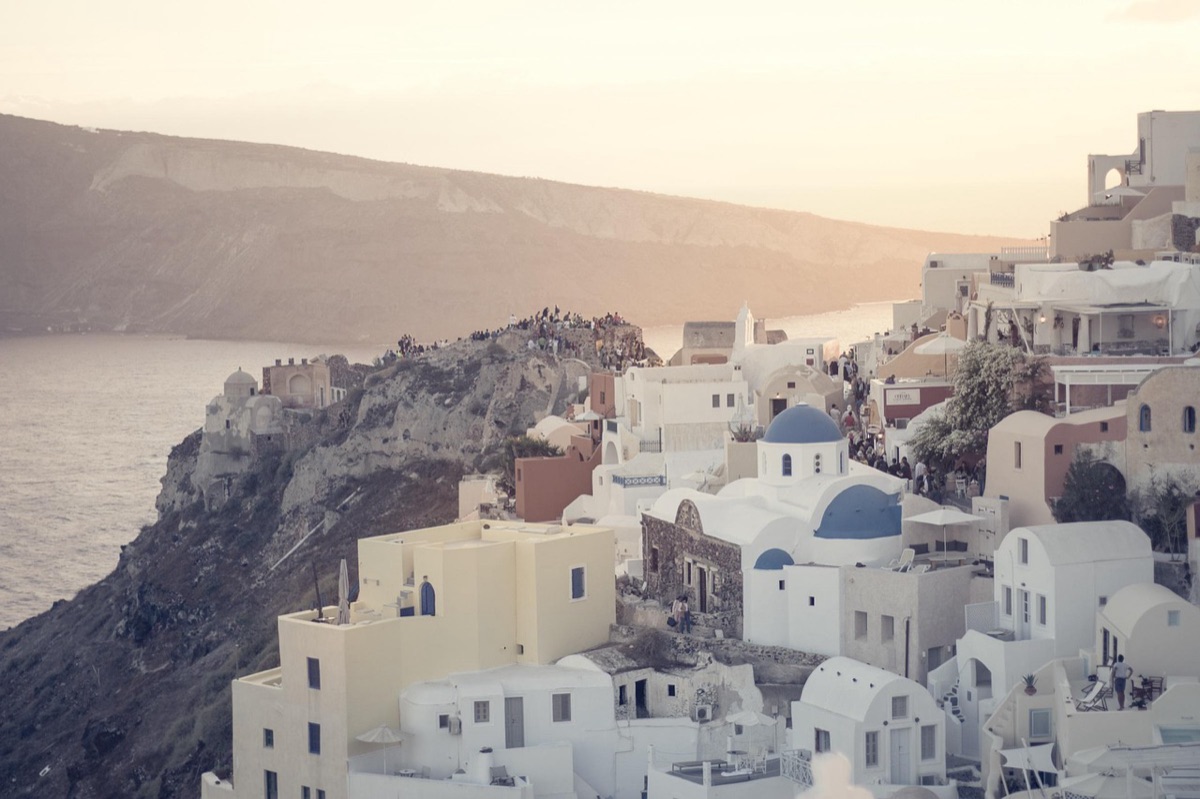 sunrise over santorini cliffs