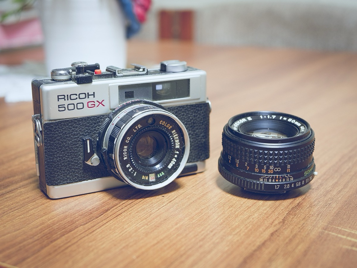 Santorini beach with camera lens cap